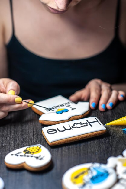 A woman makes patriotic gingerbread in support of ukraine