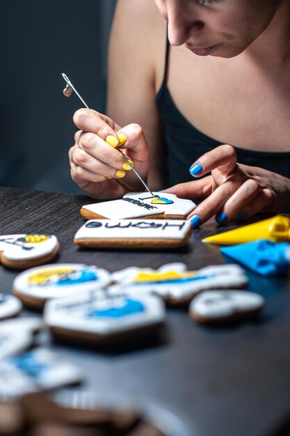 A woman makes patriotic gingerbread in support of ukraine