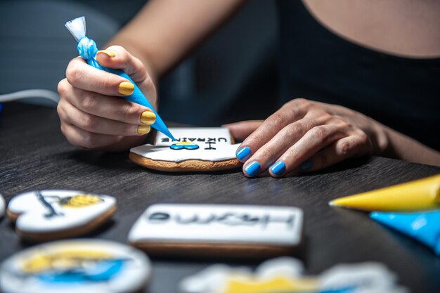 A woman makes patriotic gingerbread in support of ukraine