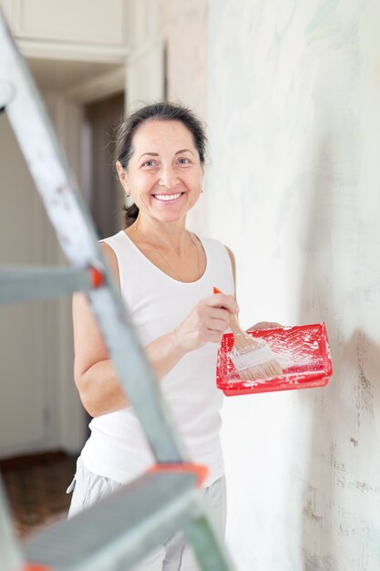 woman makes repairs at home