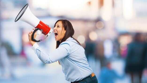 Woman making an announcement with megaphone