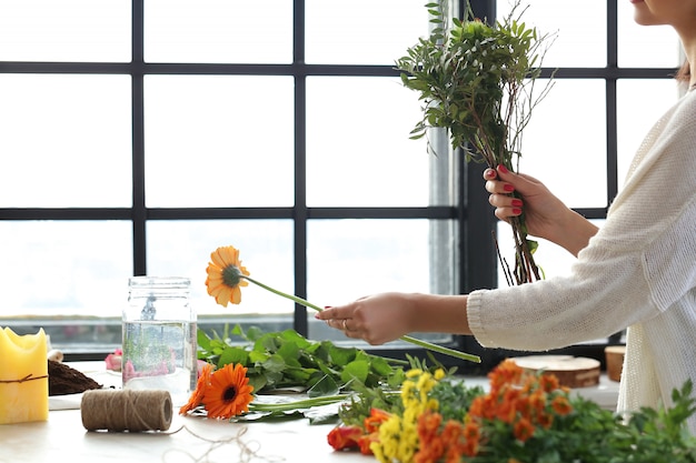 Woman making a beautiful floral bouquet