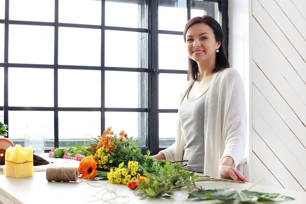 Woman making a beautiful floral bouquet