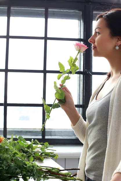 Woman making a beautiful floral bouquet