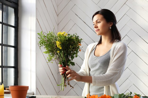 Woman making a beautiful floral bouquet