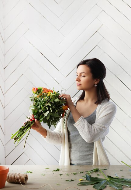 Woman making a beautiful floral bouquet