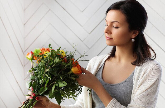 Woman making a beautiful floral bouquet