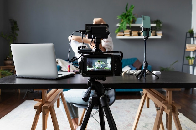 Woman making a beauty vlog with her professional camera