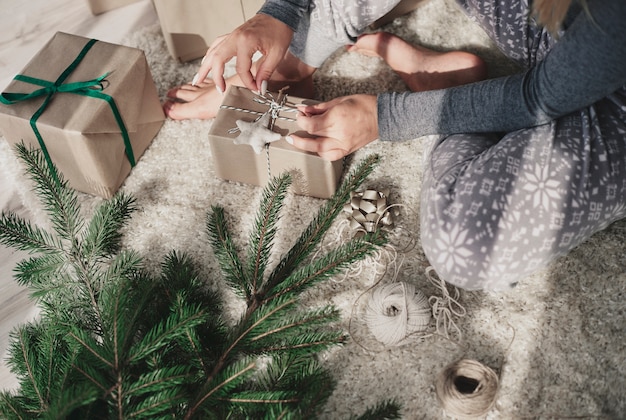 Woman making christmas presents at home