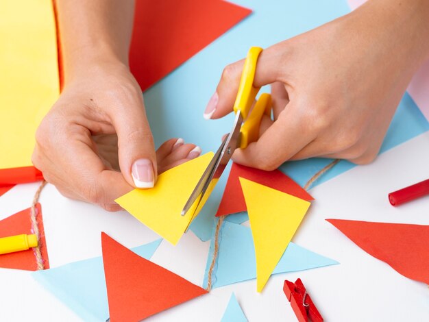 Woman making decorations with colored paper