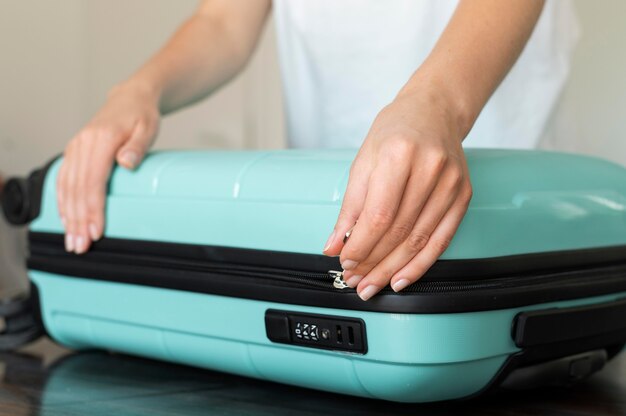 Woman making her baggage for the next vacation