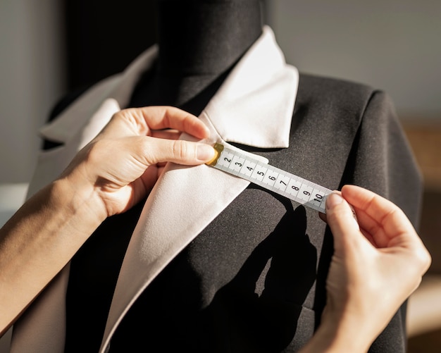 Woman making jacket close up