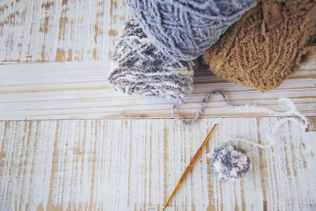 Woman making lovely bunny doll from yarn  - Easter holiday celebration concept