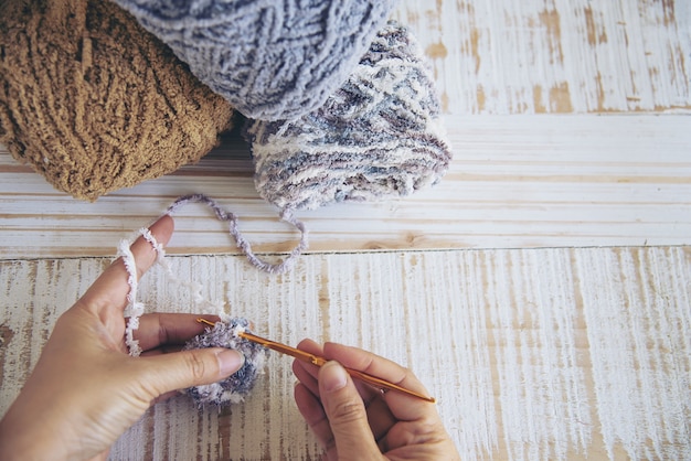 Free photo woman making lovely bunny doll from yarn  - easter holiday celebration concept