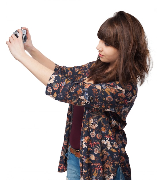 Woman making a photo with an antique camera