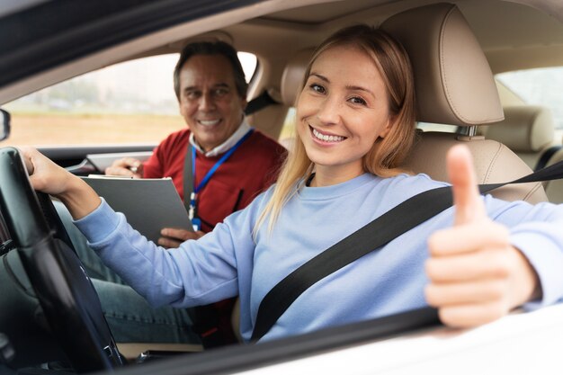 Woman and male driving instructor during driving test