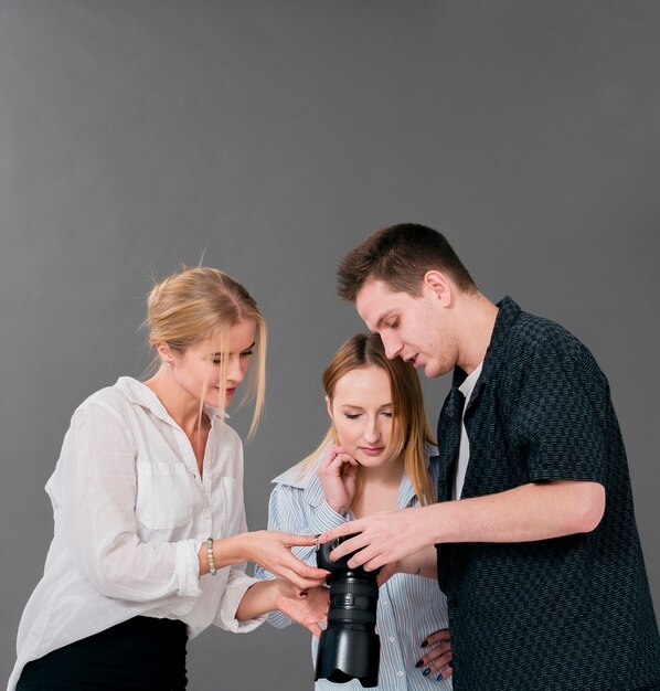 Woman and man looking through photos in studio