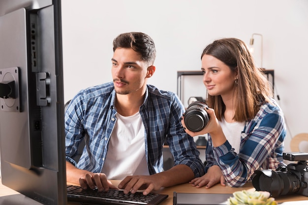 Woman and man looking together at photos