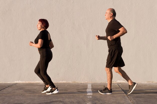 Woman and man running outdoors