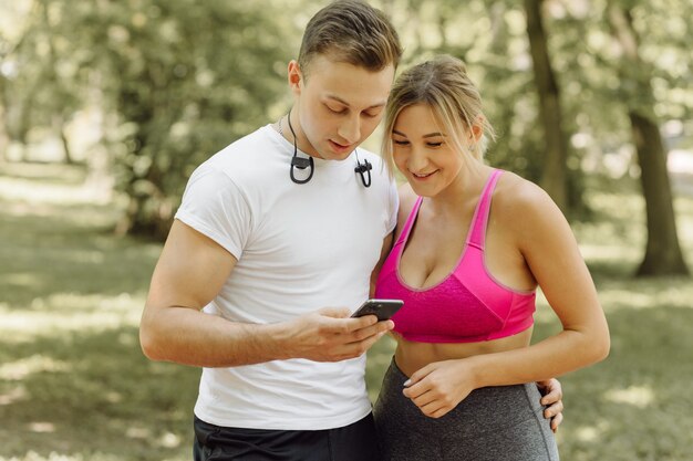 Woman and man standing in a park