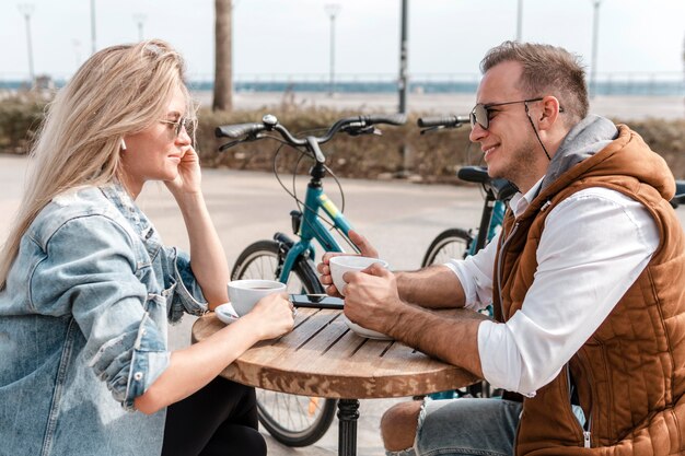 Woman and man talking next to bikes