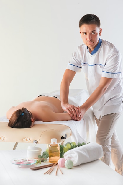 Woman in massage salon receiving a massage