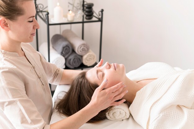 Woman massaging client