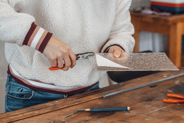 Woman master glassmaker at work in a workshop