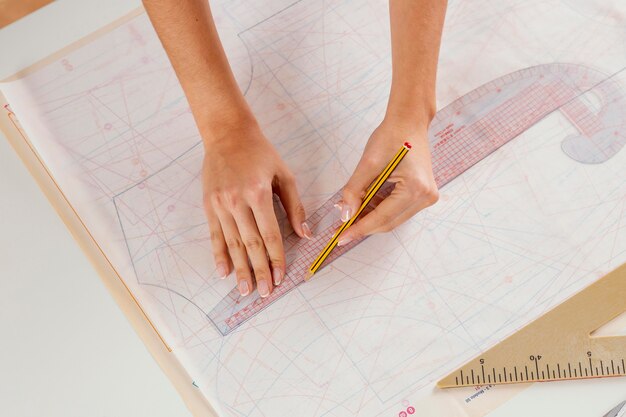 Woman measuring with ruler close-up