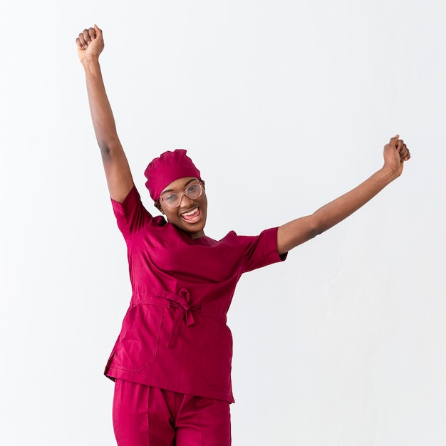 woman medic cheering with hands in the air