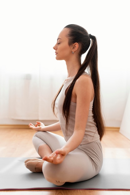 Woman meditating at home