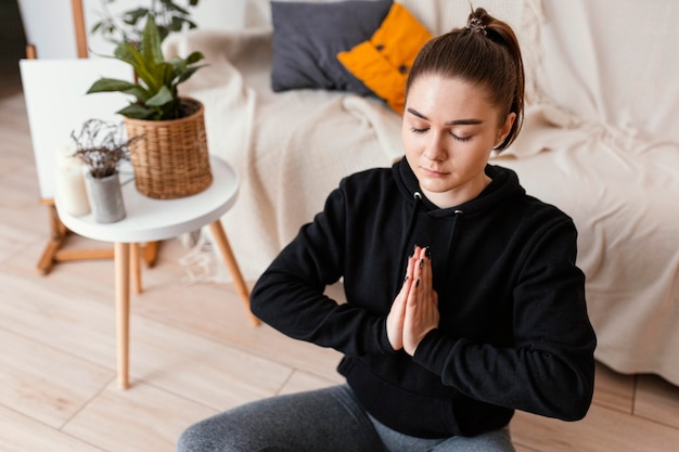 Woman meditating indoor