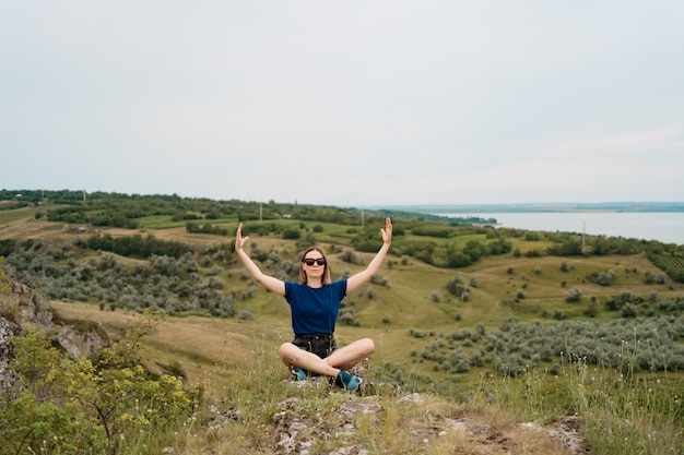 Woman meditating relaxing alone. Travel healthy Lifestyle with beautiful landscape