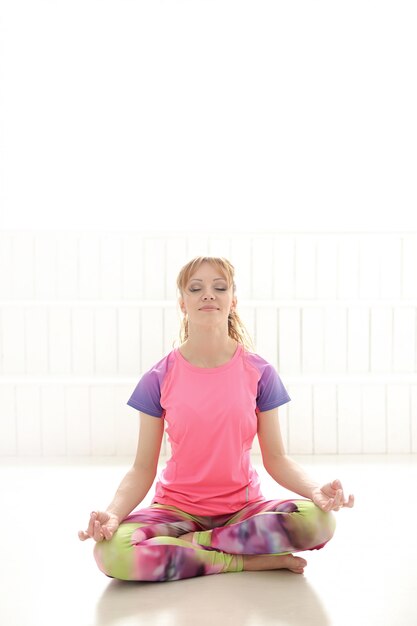 Free photo woman meditating in yoga pose