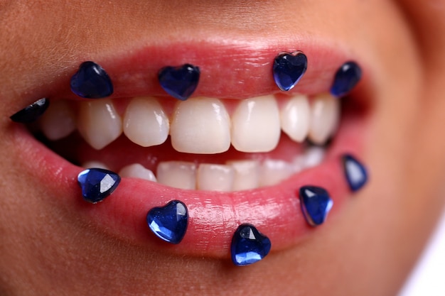 Woman mouth with colored candy