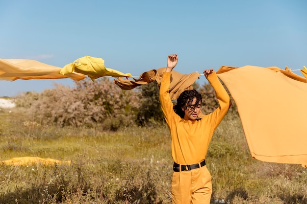 Woman in nature with clothesline