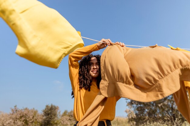 Woman in nature with clothesline