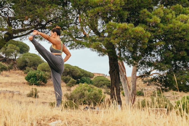 Woman, nature and yoga