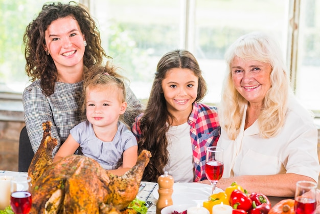 Woman near children and elderly lady