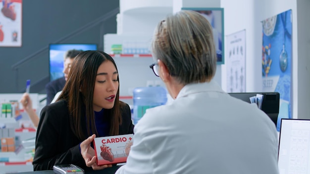 Free Photo woman needing help from pharmacist