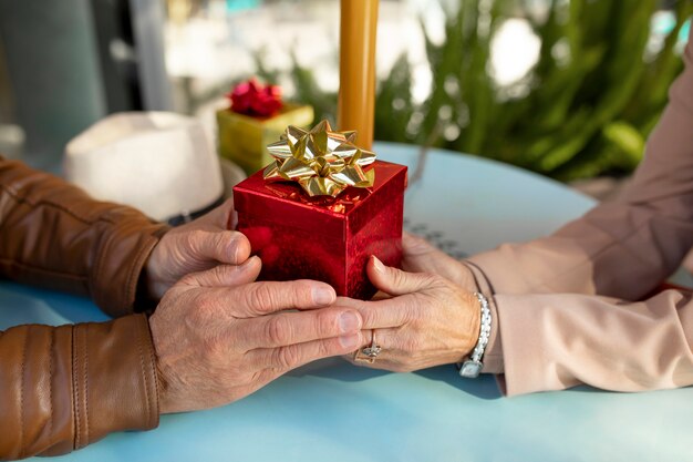 Woman offering her date a gift while being on a date