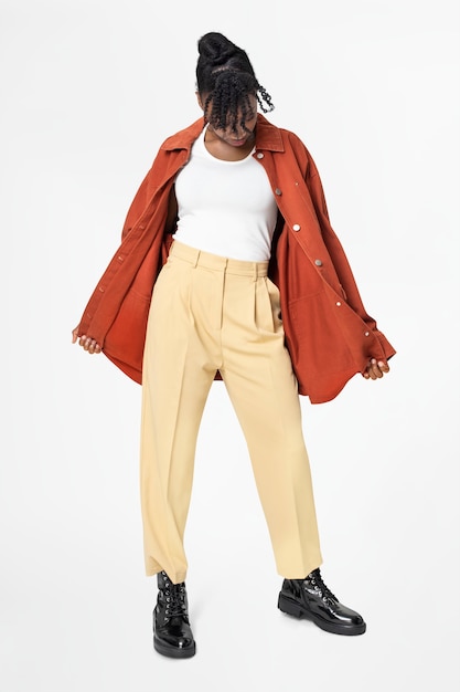 Woman in orange oversized jacket street style apparel full body