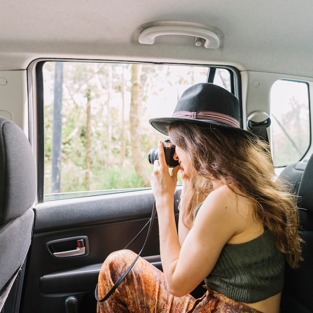 Free photo woman out of car window