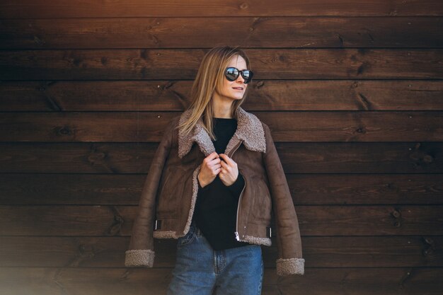 Woman outside on the wooden background