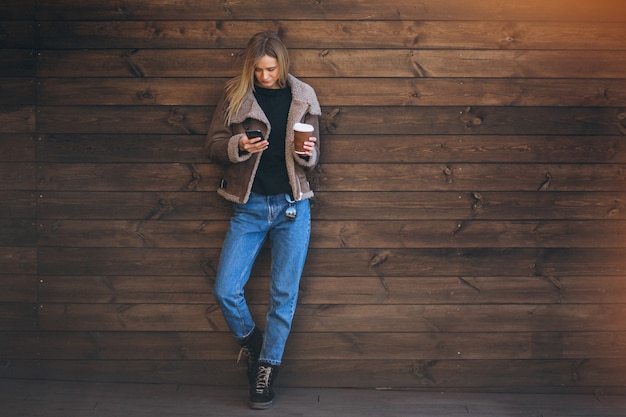 Woman outside on the wooden background