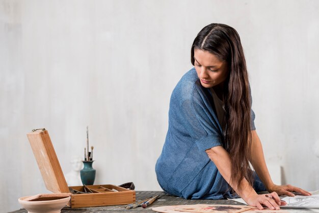 Woman painting in art studio