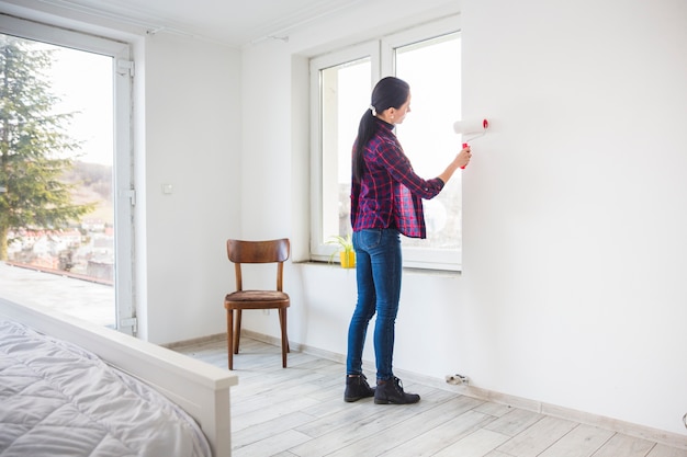 Woman Painting Wall