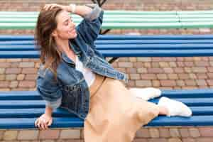 Free photo woman in park on bench