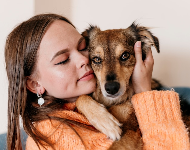 Woman petting adorable dog