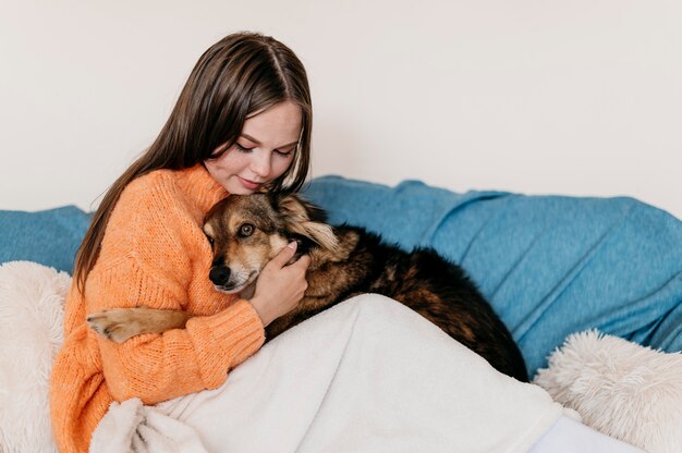 Woman petting adorable dog